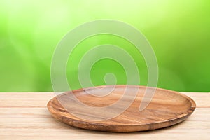 Perspective wooden table on top over blur natural background, ca