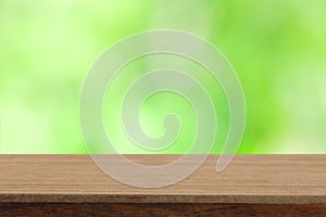 Perspective wooden table on top over blur natural background, ca