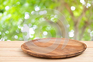 Perspective wooden table on top over blur natural background, ca