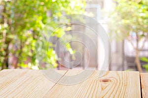 Perspective wooden table on top over blur natural background, can be used mock up for montage products display or design layout