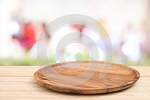 Perspective wooden table and wooden tray on top over blur bokeh