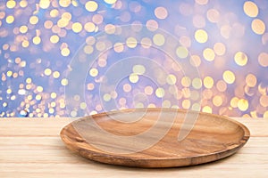 Perspective wooden table and wooden tray on top over blur bokeh