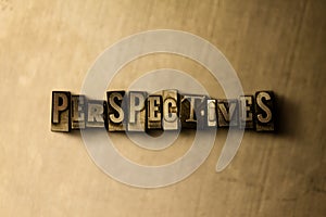 PERSPECTIVES - close-up of grungy vintage typeset word on metal backdrop