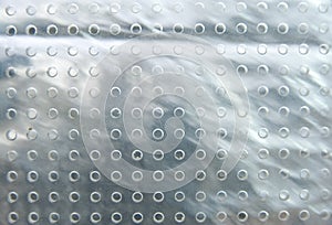 Perspex sheet with holes.