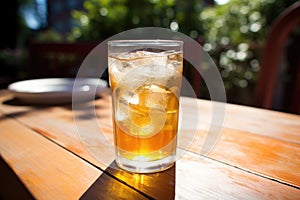 a perspiring can of soda on a sunny patio table