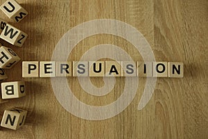 Persuasion word from wooden blocks