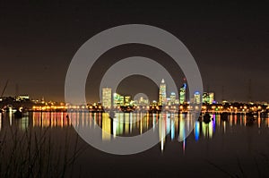 Perth swan river foreshore with boats at rest in foreground