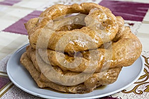 Peru Dish Dessert: BuÃ±uelos with chancaca traditional honey. Picture taken in Arequipa, Peru