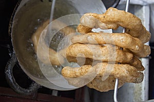 Peru Dish Dessert: BuÃ±uelos with chancaca traditional honey. Picture taken in Arequipa, Peru