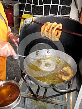 Peru Dish Dessert: BuÃ±uelos with `chancaca` traditional honey. Picture taken in Arequipa, Peru