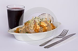 Peru Dish: Rice with Seafood (Arroz con Mariscos), served with a glass of chicha.