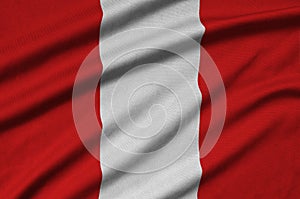 Peru flag is depicted on a sports cloth fabric with many folds. Sport team banner