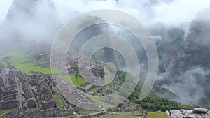 Peru Machu Picchu ancient inca ruin site Panorama with morning clouds.