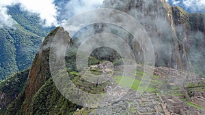 Peru Machu Picchu ancient inca ruin site Panorama with morning clouds.