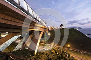 PERU Panoramic view of the Villena Rey Bridge of the Miraflores district with luxurious apartments and Pacific Ocean at night