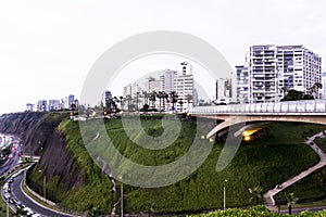 PERU Panoramic view of the Villena Rey Bridge of the Miraflores district with luxurious apartments and Pacific Ocean at night