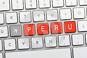 PERU writing on white keyboard with a aircraft sketch