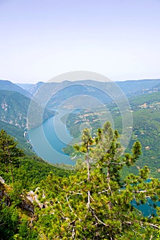 Perucac Lake glistening beneath Banjska Stena viewpoint on majestic Mount Tara