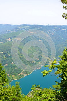 Perucac Lake glistening beneath Banjska Stena viewpoint on majestic Mount Tara