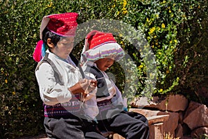 A Peruvian boy knits with 4 needles.