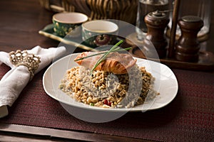 Peruvian chaufa chinese fried rice with fried fish photo