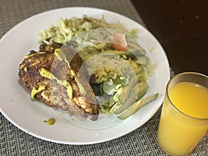 Peruvian chicken with salad photo