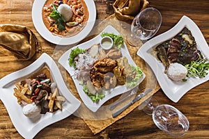 Peruvian food, ceviche, lomo saltado, piqueo on an elegant restaurant table