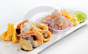 Peruvian food: chicharrones de pescado with ceviche cebiche . photo