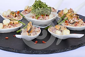 Peruvian food: Choros a la chalaca, mussels seasoned with onion, tomato and lemon photo