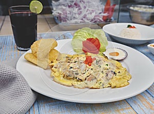 Peruvian food, `tortilla de mariscos` seafood omelette photo