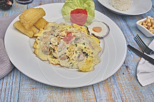 Peruvian food, `tortilla de mariscos` seafood omelette photo