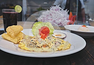 Peruvian food, `tortilla de mariscos` seafood omelette photo