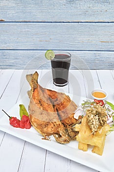 PERUVIAN FOOD, typical dish Fried trout, with rice, yucca and salad, Sective Focus photo