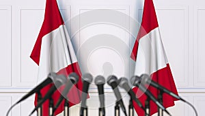 Peruvian official press conference. Flags of Peru and microphones. Conceptual 3D rendering
