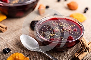 Peruvian purple jam dessert called mazamorra morada with dried fruits and cinnamon