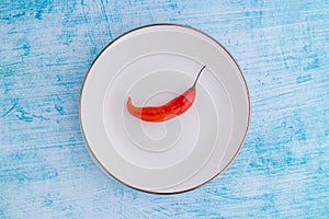 Peruvian red hot chili AjÃ­ Limo in a colored plate