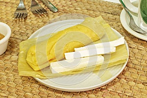 Peruvian-style salty humita tamale with cheese served photo