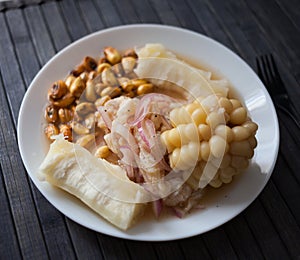 Peruvian traditional dish.fish ceviche with yuka and corn