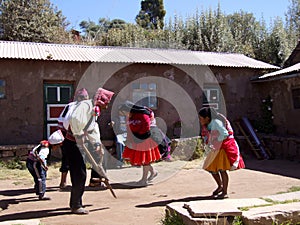 Peruvians dancing in costumes on Taquile Island