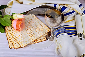 Pesah celebration concept jewish, Matzoh and red sweet wine Passover holiday and spring flowers