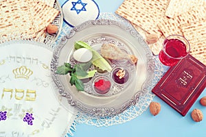 Pesah celebration concept (jewish Passove holiday). Traditional text in hebrew: Passover, horseradish, sweet dates jam