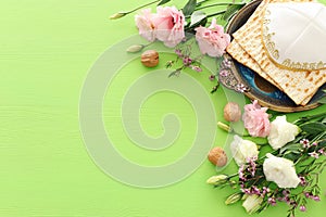 Pesah celebration concept & x28;jewish Passover holiday& x29; over green background. top view flat lay