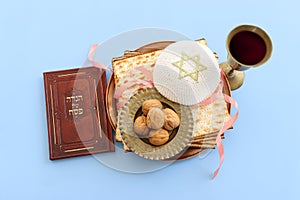 Pesah celebration concept (jewish Passover holiday). Translation of Traditional pesakh book with text: passove tale