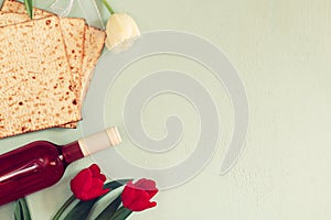 Pesah celebration concept (jewish Passover holiday) with wine and matza