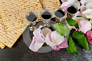 Pesah celebration four cup kosher wine Traditional jewish holiday with matzo unleavened bread