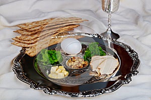 Pesah celebration Passover holiday. Traditional pesah plate text in hebrew: Passover, egg,