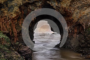 Pescadero Arch Rock closeup during winter sunset