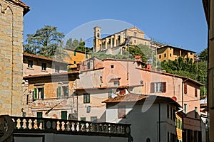 Pescia, Pistoia, Tuscany, Italy: cityscape of the old town with the ancient convent of San Francesco di Paola on the hilltop