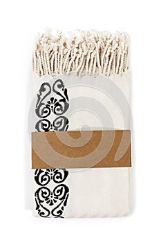 Peshtemal Turkish towel folded beige textile for spa, beach, pool, light travel, healthy fashion and gifts. Traditional turkish