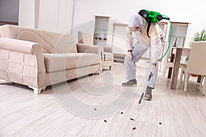 The pest control contractor working in the flat